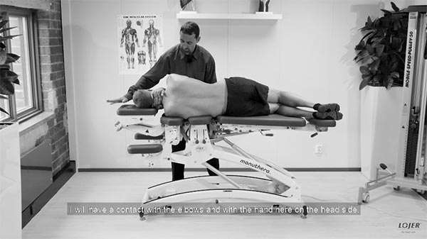 Image of a patient lying on his side on the manipulation table